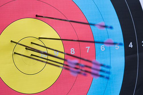 Arrows in the gold centre of an archery target